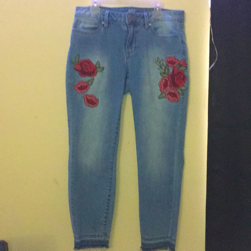 Light Blue jeans with red roses on the sides